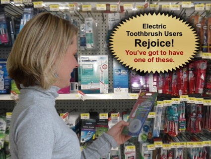 lady at toothbrush display viewing the HandleDry electric toothbrush accessory